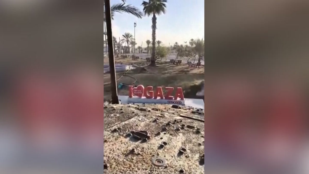 Israeli tank drives over ‘I love Gaza’ sign as military takes control of Rafah crossing